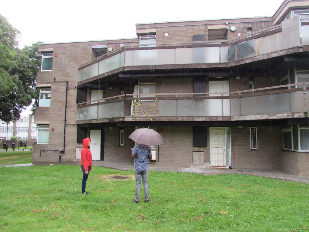 Inpecting balconies in the rain